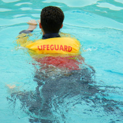 lifeguard in the water with clothes
