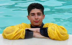 lifeguard swimming fully clothed in pool