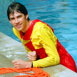 lifeguard in pool wearing an anorak