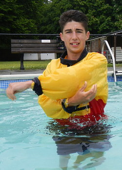 lifeguard stretching in wet anorak