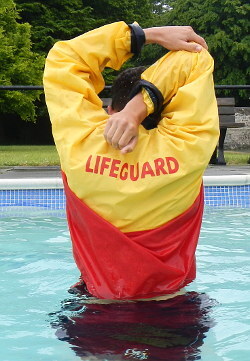 lifeguard stretching in wet anorak