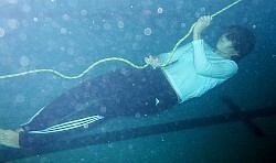lifesaving survival swimming underwater in a pool